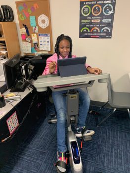 Student learning on the exercise bike