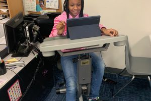 Student learning on the exercise bike